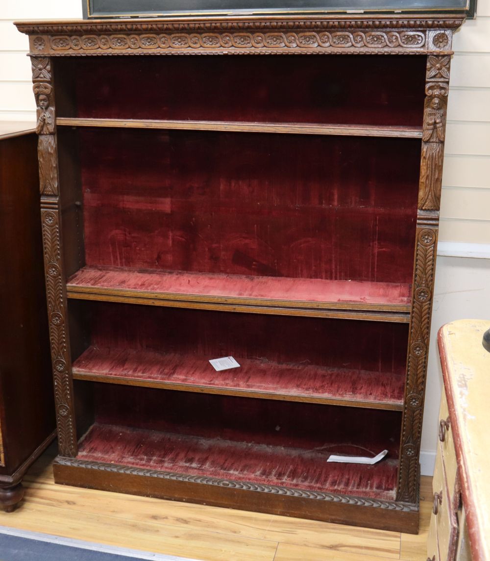 A late Victorian carved oak open bookcase, W.126cm, D.30cm, H.153cm